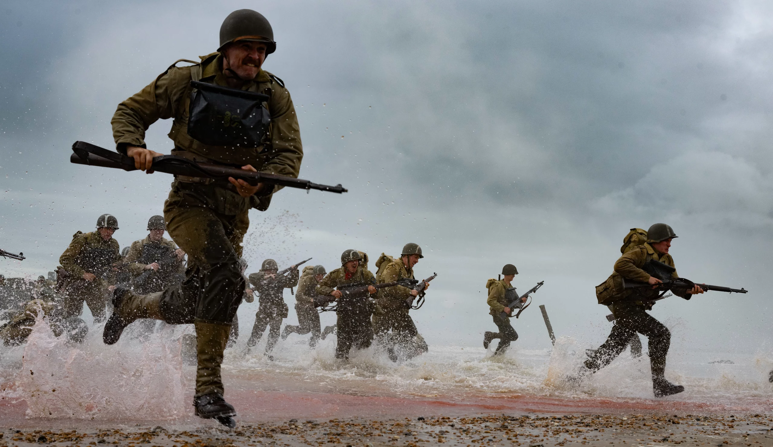 Soldiers running through muddy battle fields on the set of Pressure.